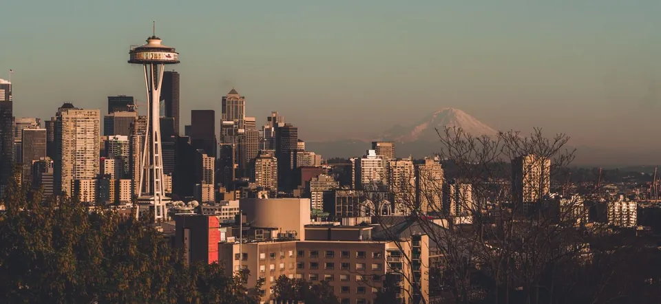 The Seattle skyline at dusk with Mount Rainier in the distance